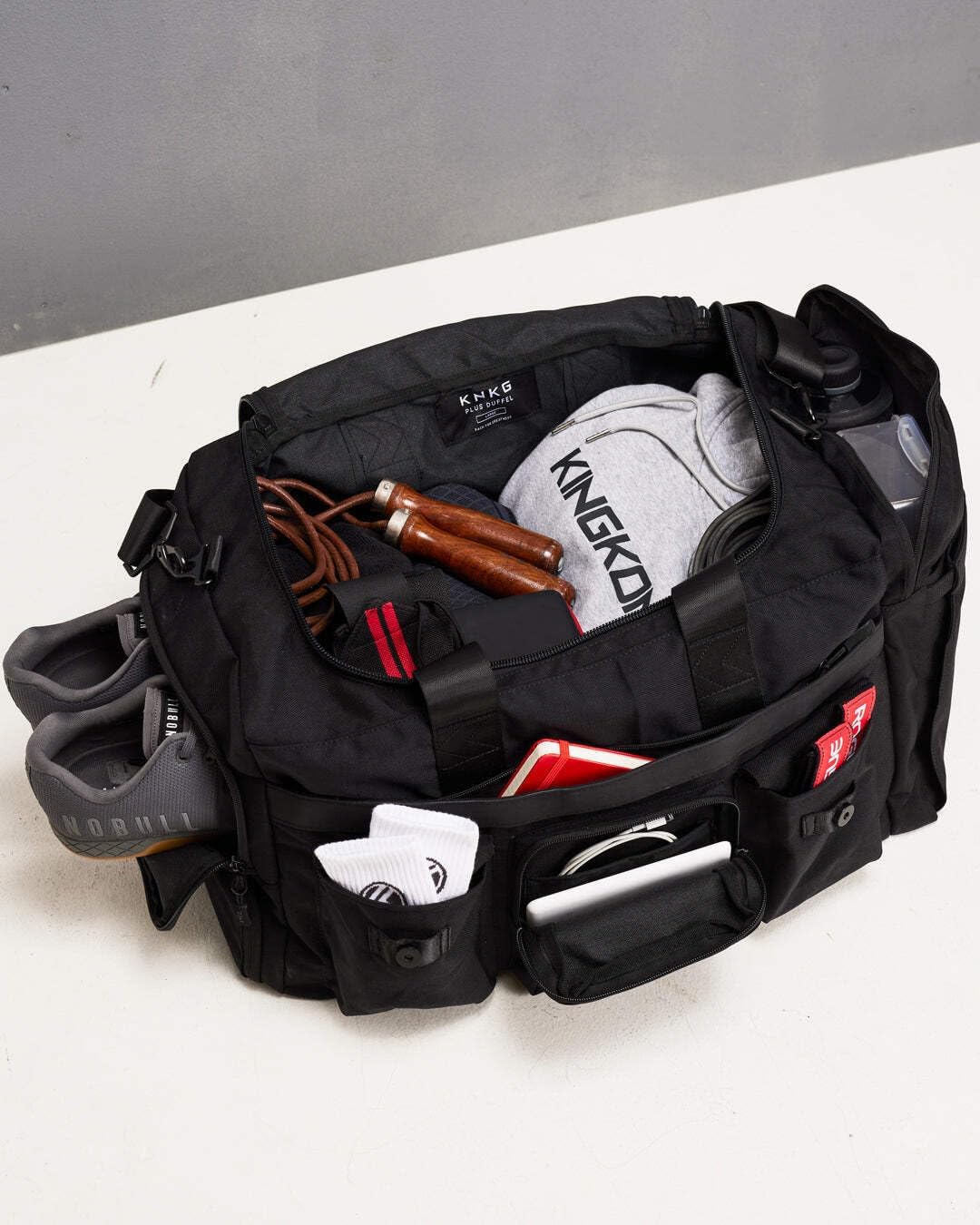PLUS 63L Large Duffel Bag – Spacious, Durable Gym Bag with Dual Shoe Storage, Multiple Compartments & YKK Zippers for Fitness & Travel - Redwood (Black, Large 63L)