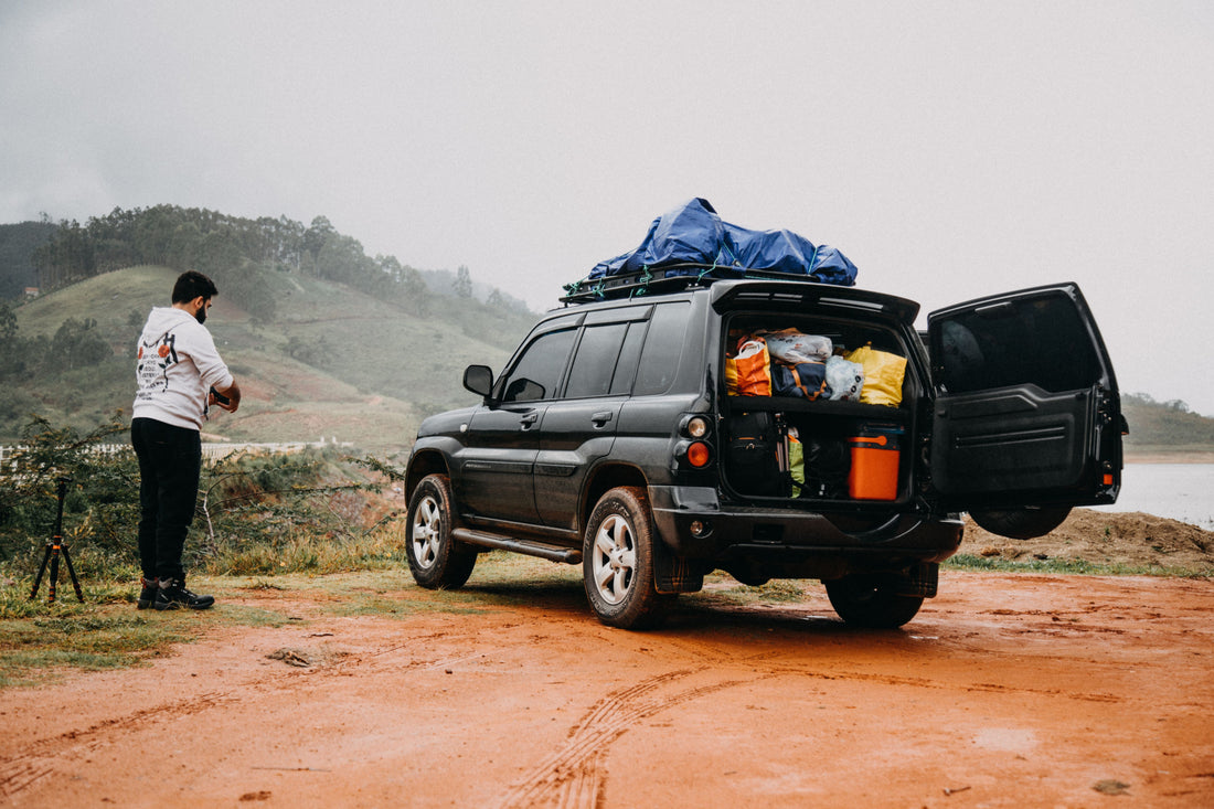 SUV with open trunk packed with road trip gear
