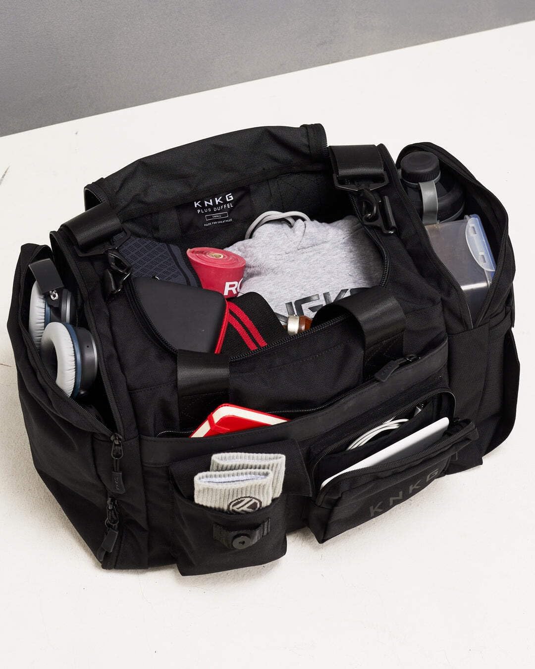 KNKG PLUS 63L Large Duffel Bag – Spacious, Durable Gym Bag with Dual Shoe Storage, Multiple Compartments & YKK Zippers for Fitness & Travel - Redwood (Black, Small 33L)