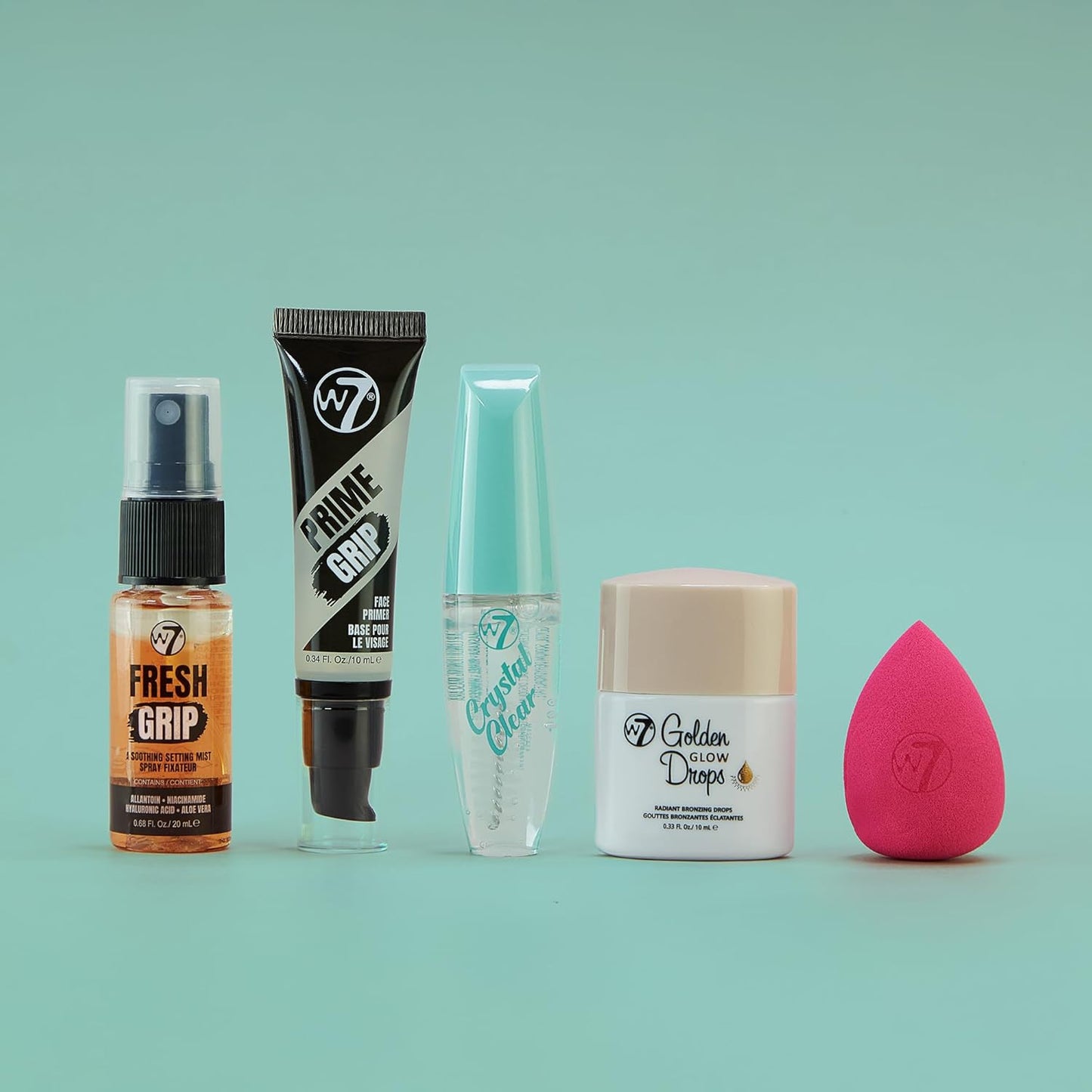 W7 On the Go Essentials Gift Set - Mini Makeup Must-Haves with Primer, Setting Spray, Mascara, Golden Glow Bronzing Drops & Beauty Sponge - Travel or Handbag Size Essentials