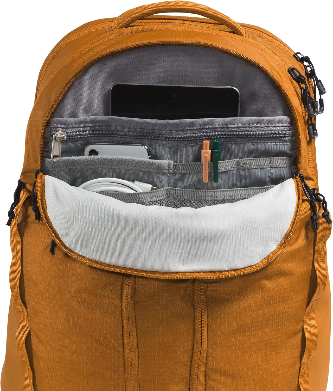 The North Face Surge Commuter Laptop Backpack | Daypack with Water Repellent Finish, 16" Laptop Sleeve, Reflective Details, Timber Tan, One Size